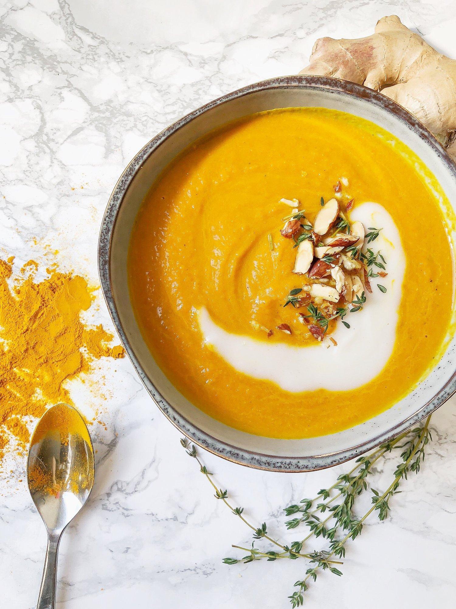 Carrot ginger turmeric soup in a bowl